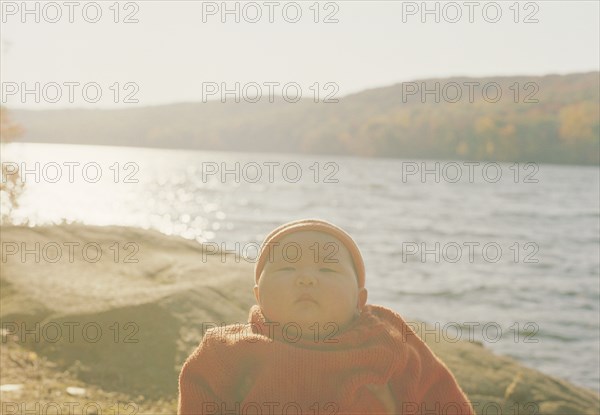 Asian baby girl at remote lake