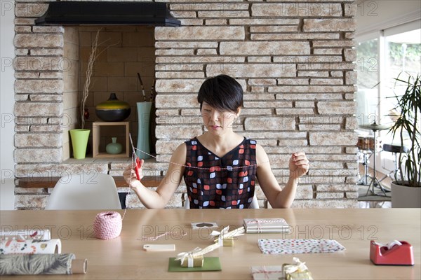 Japanese woman wrapping gifts