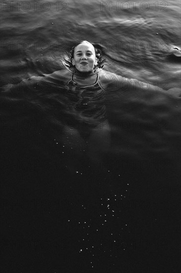 Girl swimming in lake