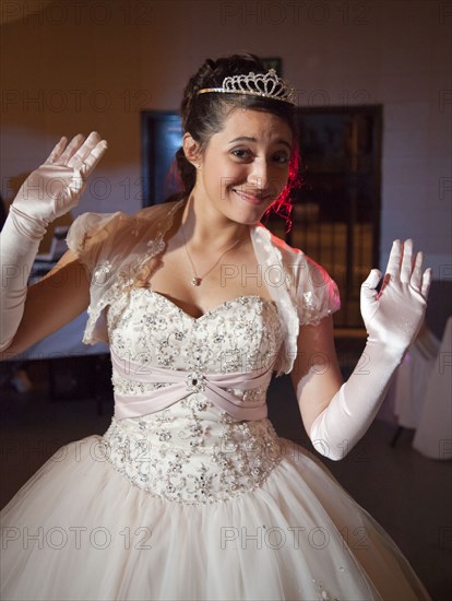 Teenage girl posing in quinceanera dress