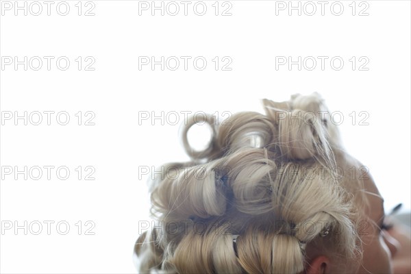 Close up of hair of Caucasian woman in rollers