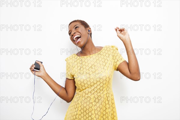 Dancing Black woman dancing to mp3 player