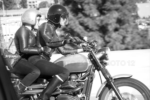 Blurred view of women riding motorcycle