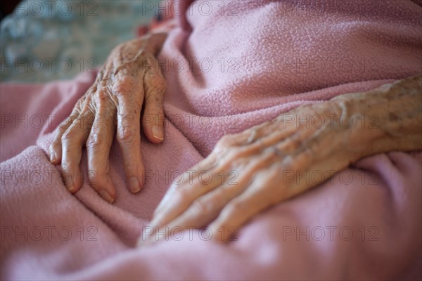Close up of wrinkled hands of senior woman