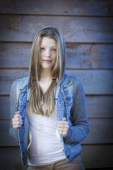 Smiling girl wearing denim jacket