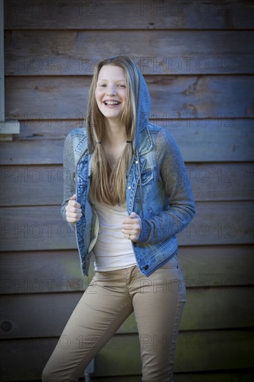 Smiling girl wearing denim jacket