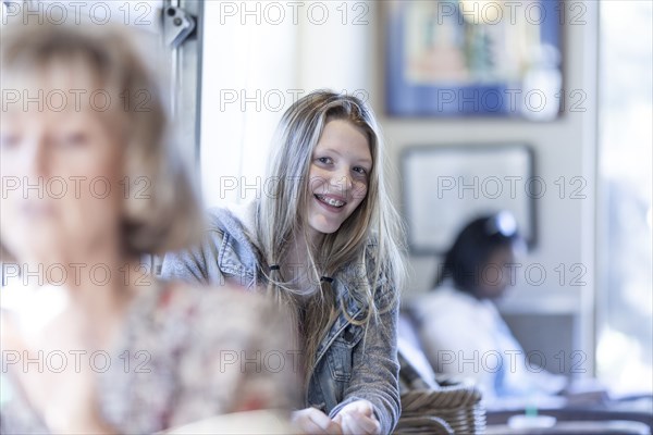 Smiling girl sitting in waiting area