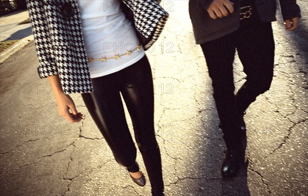 Couple walking on cracked street