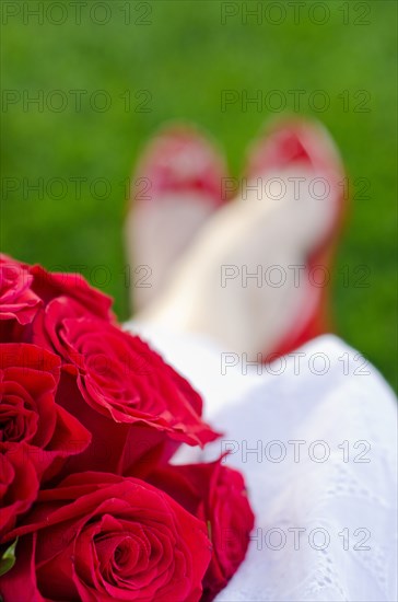 Caucasian bride holding bouquet of flowers