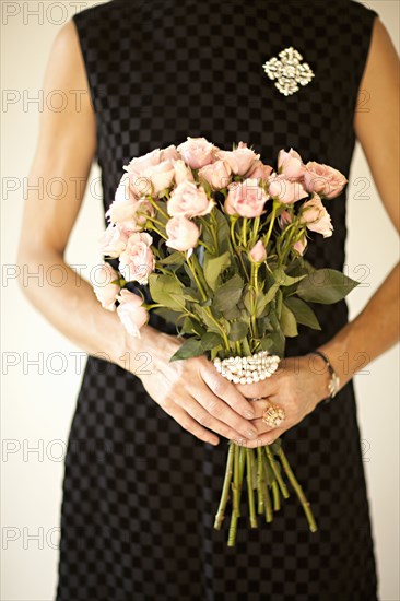 Woman holding bouquet of flowers