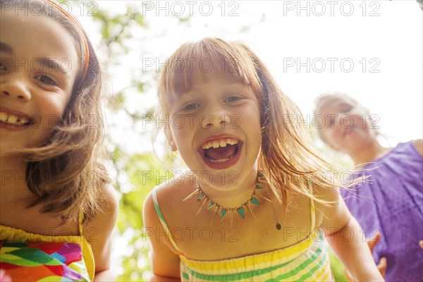Close up of girls laughing outdoors