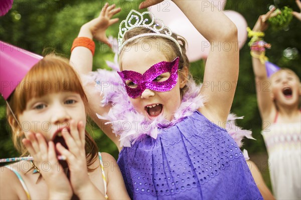 Girls playing dress-up at birthday party