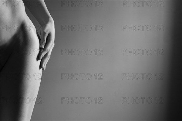 Close up of hip and leg of nude Caucasian woman