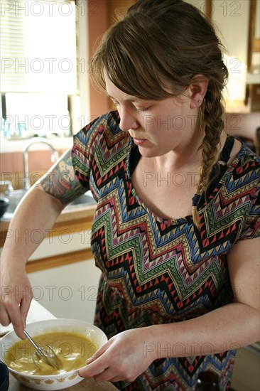 Close up of woman cooking in kitchen