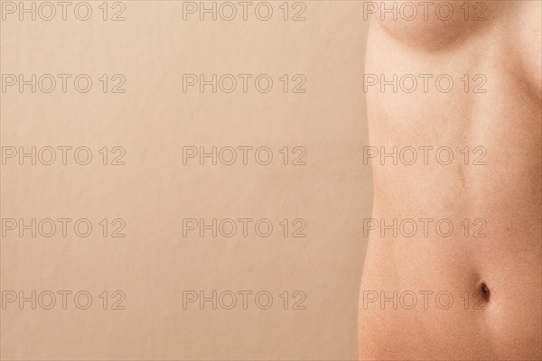 Close up of midsection of nude woman