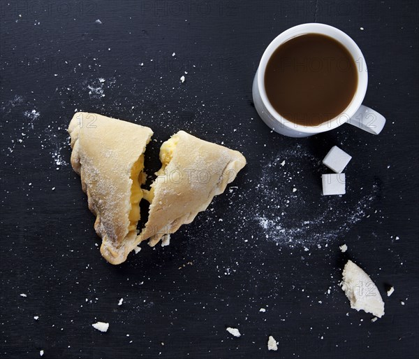 Breakfast pastry and cup of coffee