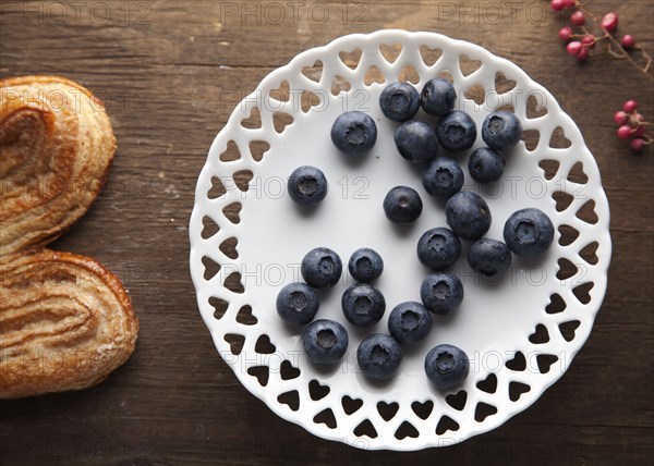 Plate of blueberries with pastry