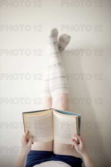 High angle view of woman reading book