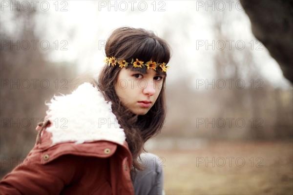 Serious Caucasian woman wearing flower crown