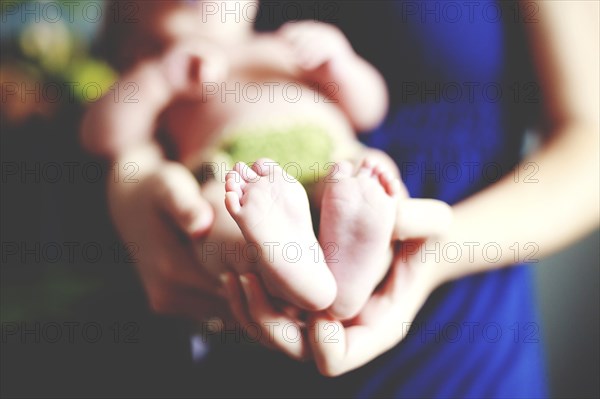 Close up of girl holding baby