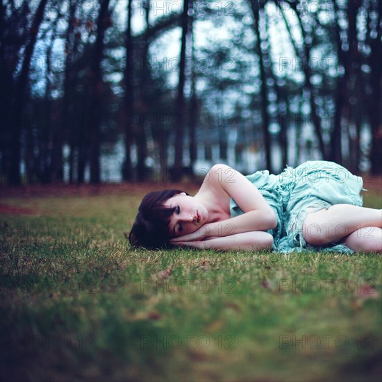 Caucasian woman napping in empty park