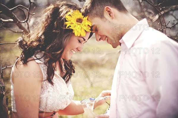 Couple touching foreheads in park