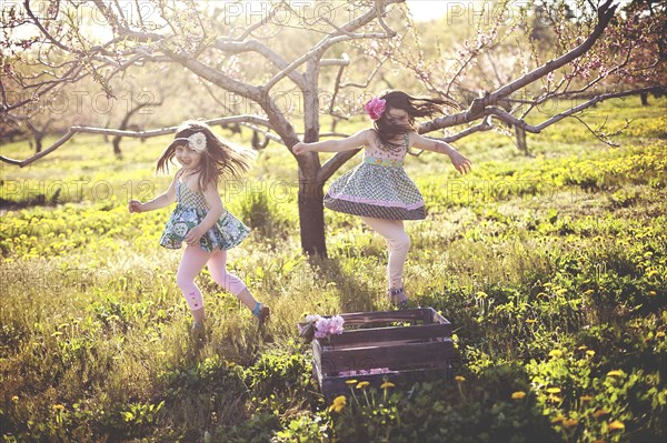 Girls playing in rural field