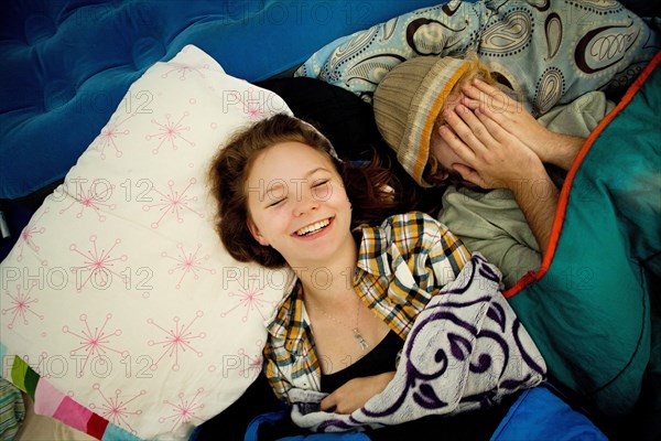 Couple laughing in camping tent