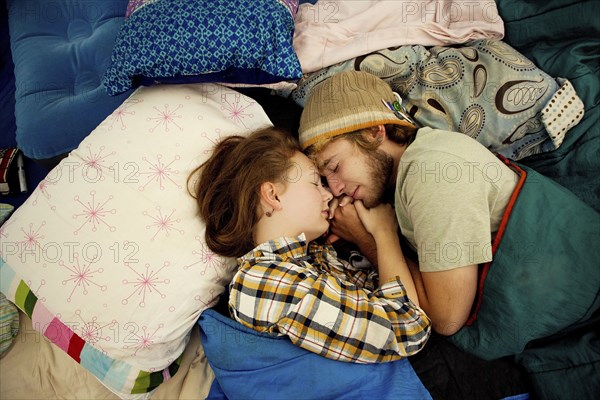 Couple sleeping in camping tent