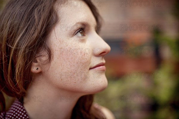 Close up of teenage girl looking up