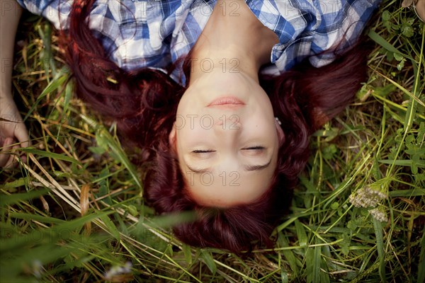 Close up of girl laying in grass