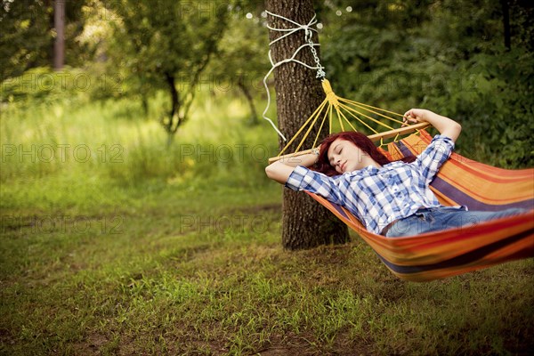 Sleeping girl laying in hammock