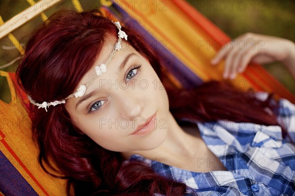 Girl wearing flower crown in hammock