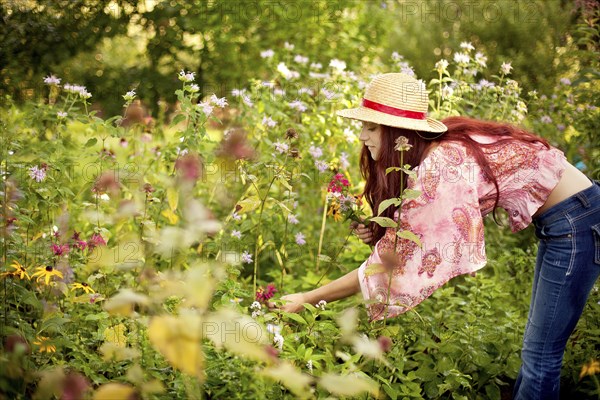 Gardener admiring plants in garden