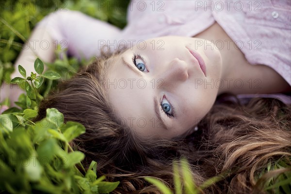 Close up of woman laying in grass