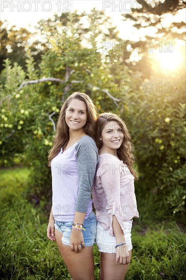 Caucasian women smiling in rural field