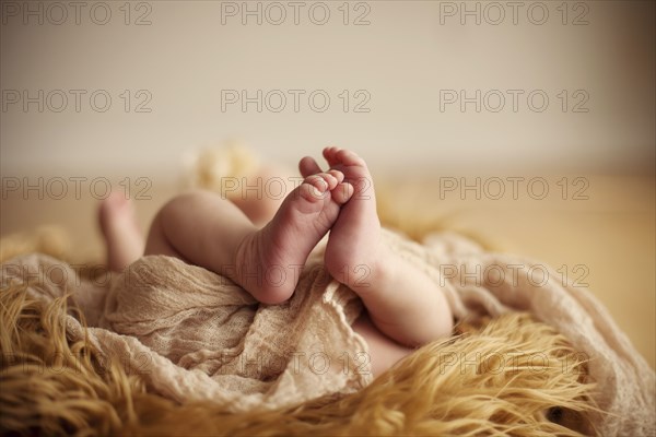 Close up of baby girl on furry carpet