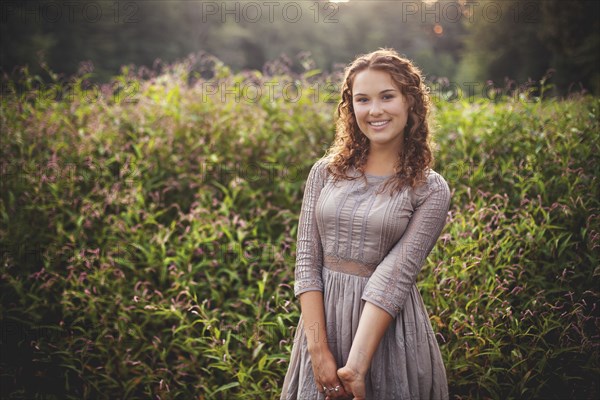 Woman smiling in rural field