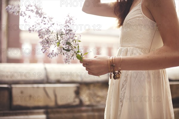 Close up of woman holding flowers
