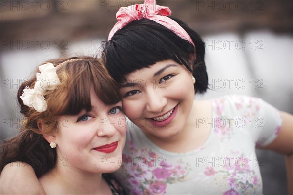 Close up of smiling women hugging