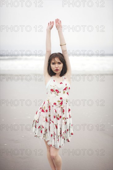 Caucasian woman standing on beach