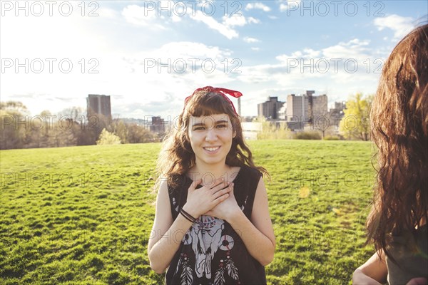 Caucasian woman standing in urban park