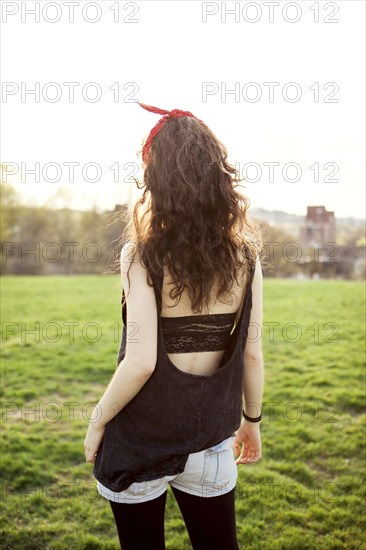 Caucasian woman walking in urban park