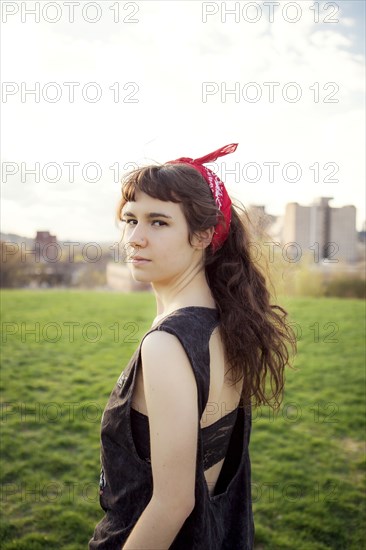 Caucasian woman standing in urban park