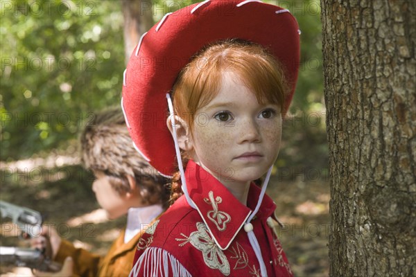 Close up of Caucasian girl wearing cowgirl costume