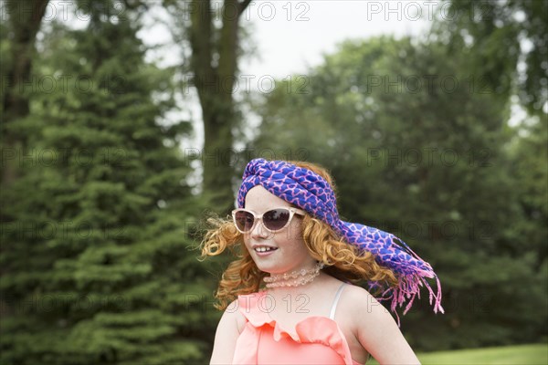 Caucasian girl walking in rural field