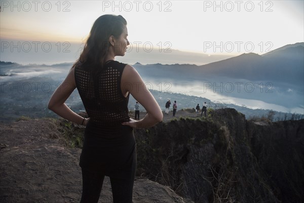 Woman admiring rural landscape from mountaintop