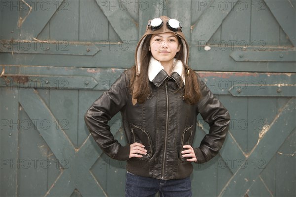 Mixed race girl wearing aviator goggles