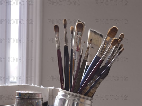 Close up of paintbrushes in jar