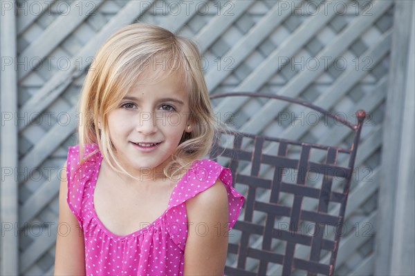 Caucasian girl sitting in chair